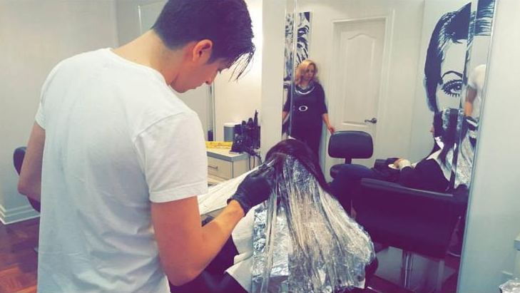 Marc David foiling a client's hair in his studio