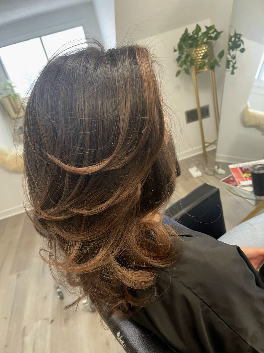 Brunette balayage with face-framing layers
