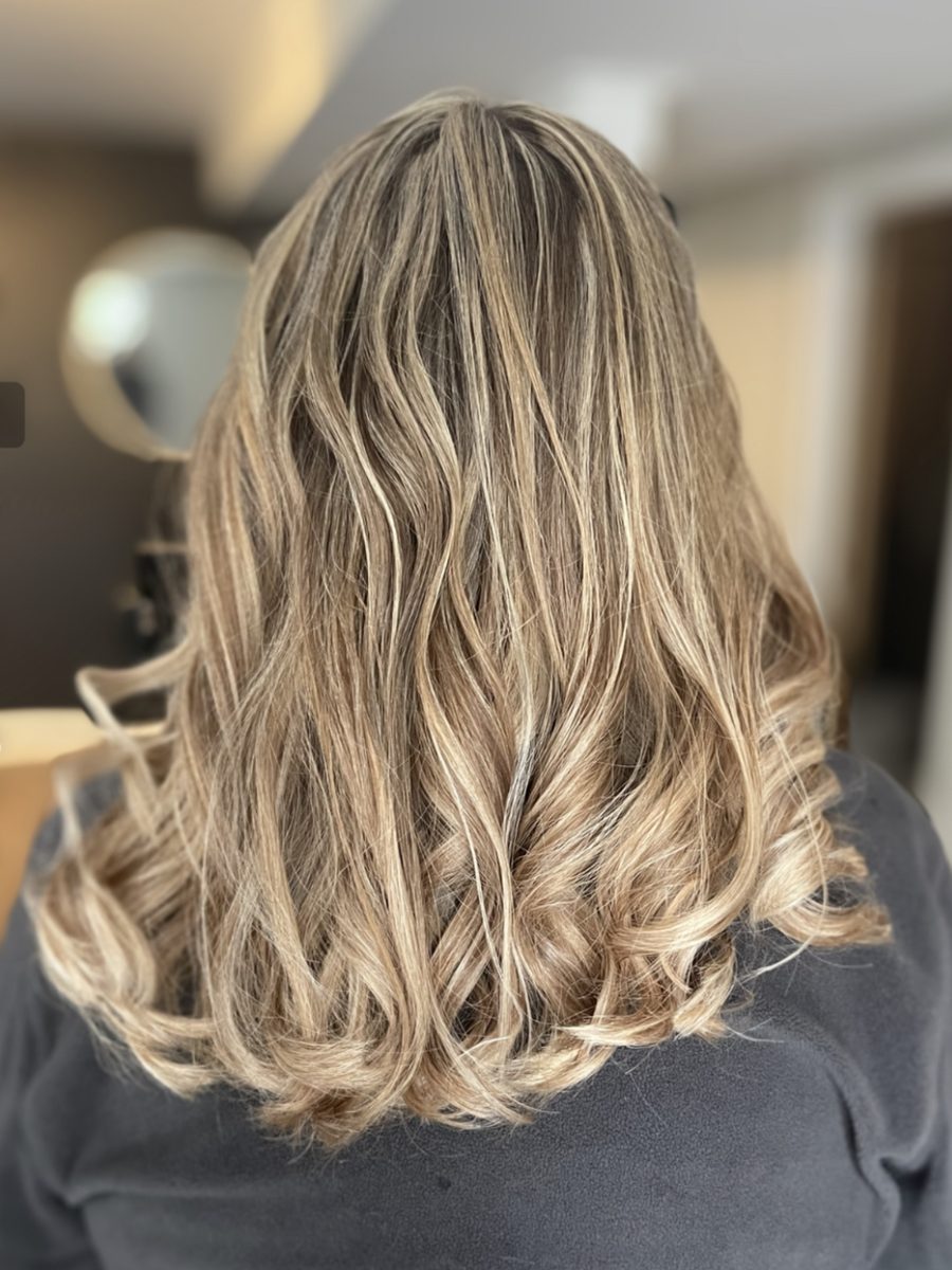 Beige blonde balayage with soft beachy waves, back view